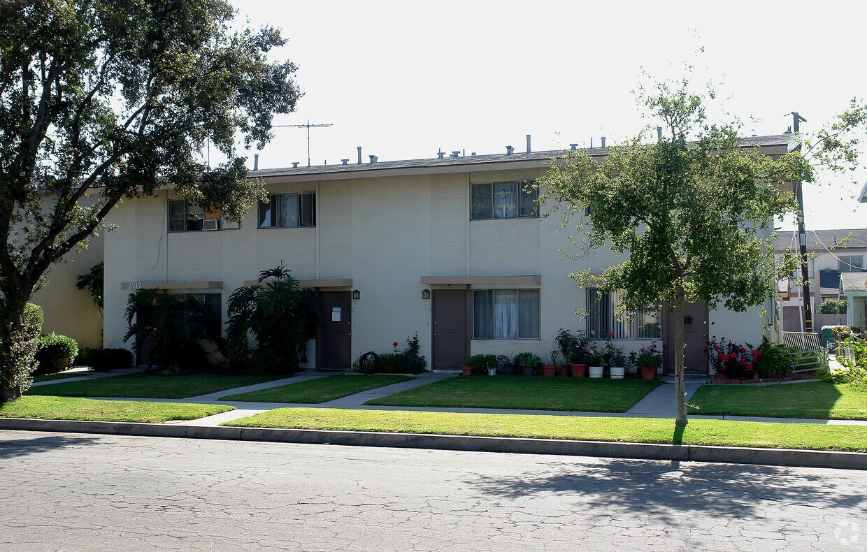Garden-style townhome community with mature trees and landscaped yards