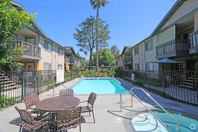 Senior apartment community with pool patio and mature landscaping